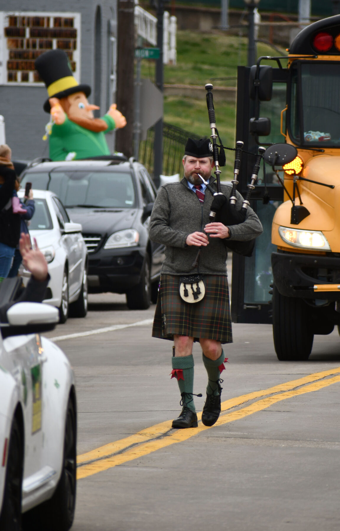 Mike Kotch plays the bagpipes in the parade